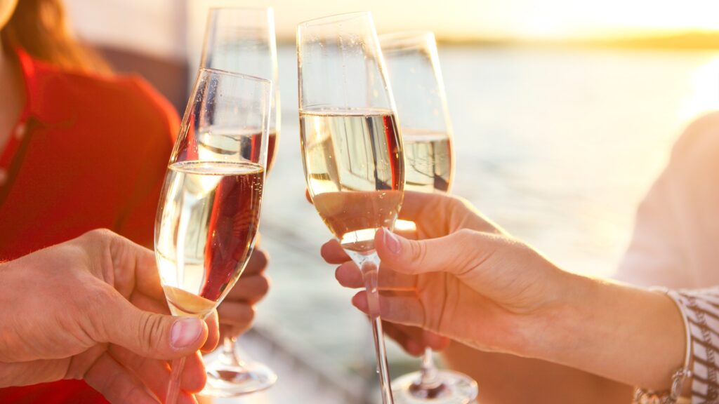 happy friends with glasses of champagne on yacht vacation trav picture id585788256